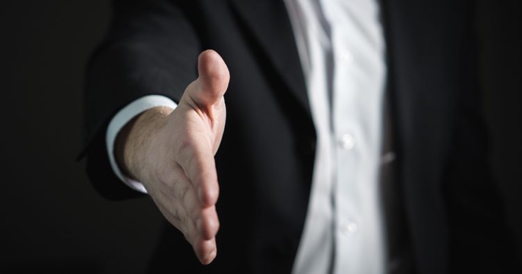 Business Professional extending hand for a handshake